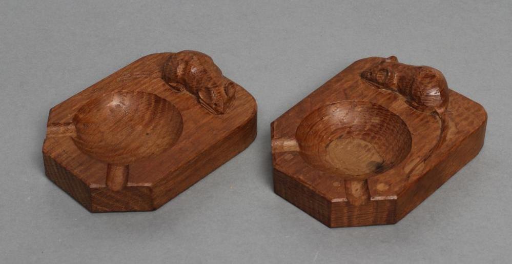 A PAIR OF ROBERT THOMPSON ADZED OAK ASHTRAYS of canted oblong form Image