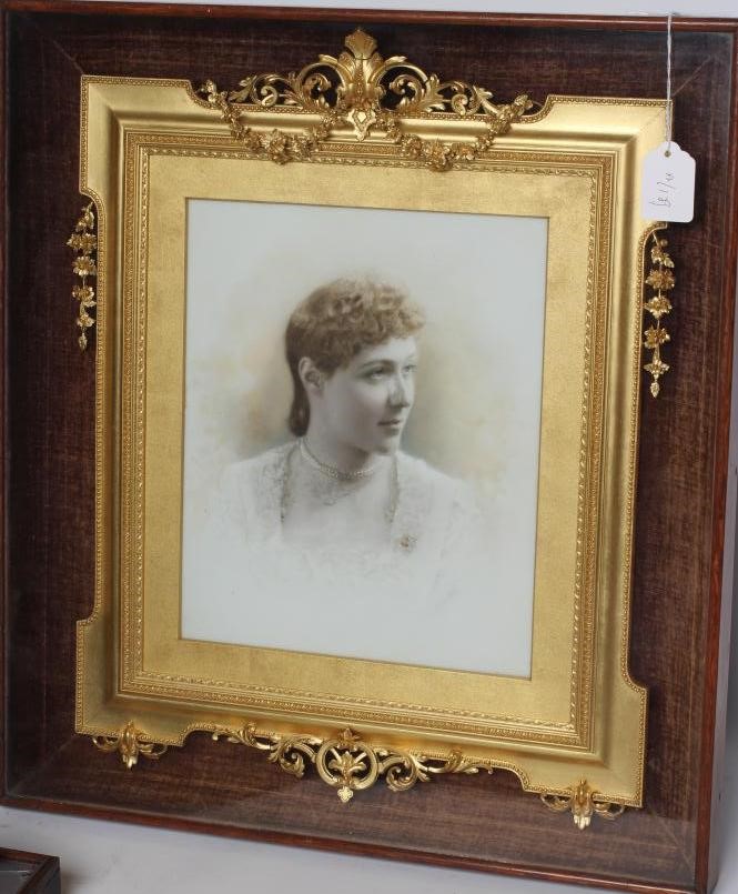 A VICTORIAN GILT GESSO PICTURE FRAME of earred oblong form with pierced scroll surmount hanging Image