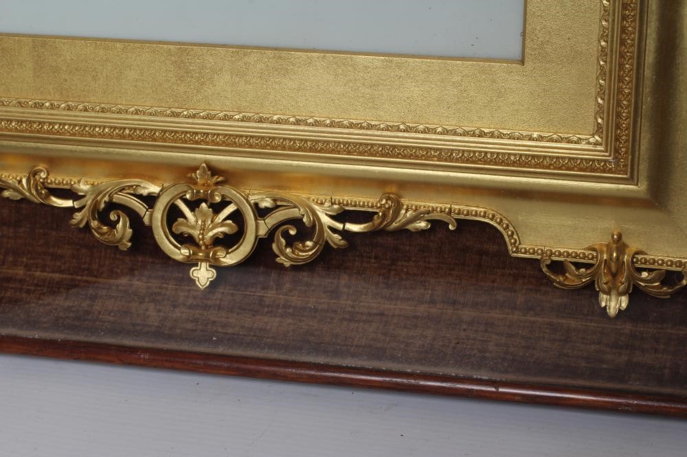 A VICTORIAN GILT GESSO PICTURE FRAME of earred oblong form with pierced scroll surmount hanging Image