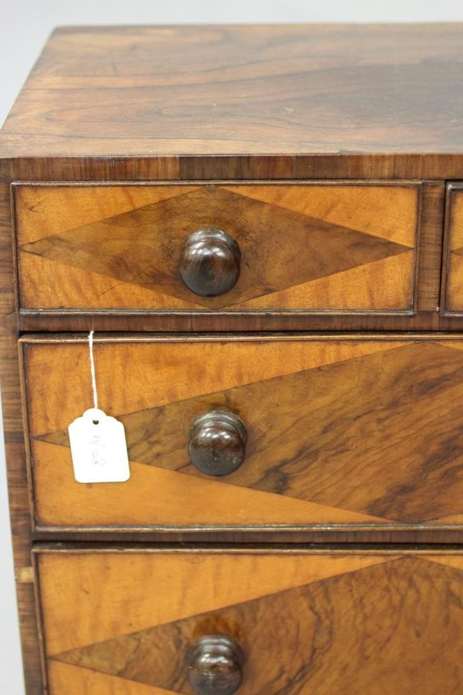 A VICTORIAN ROSEWOOD APPRENTICE CHEST of two short and three long drawers with turned wood handles Image