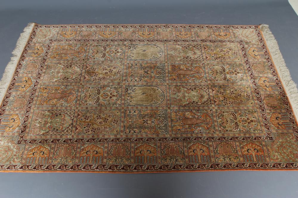 A PERSIAN SILK RUG in salmon and pale green Image