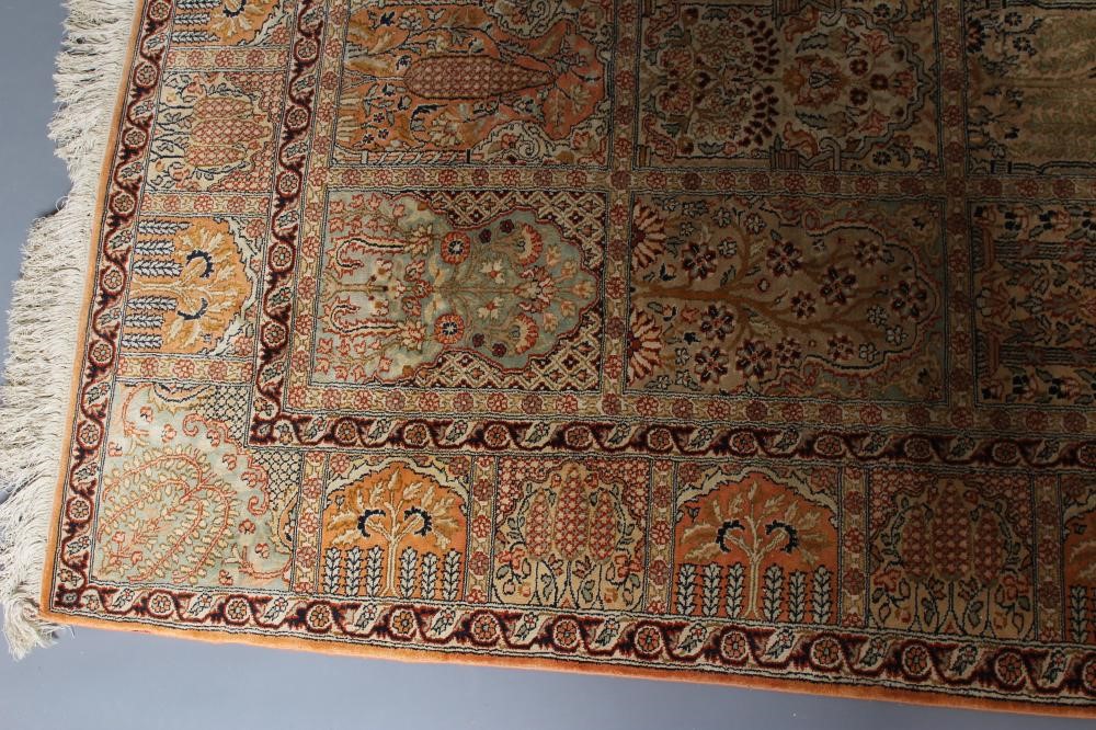 A PERSIAN SILK RUG in salmon and pale green Image