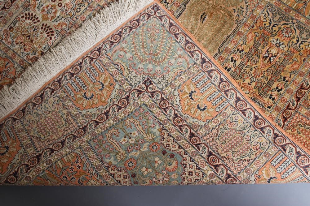 A PERSIAN SILK RUG in salmon and pale green Image