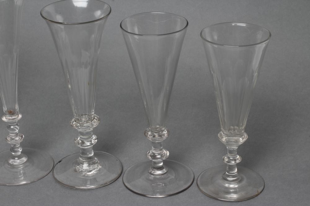 A COLLECTION OF EIGHT CHAMPAGNE FLUTES Image