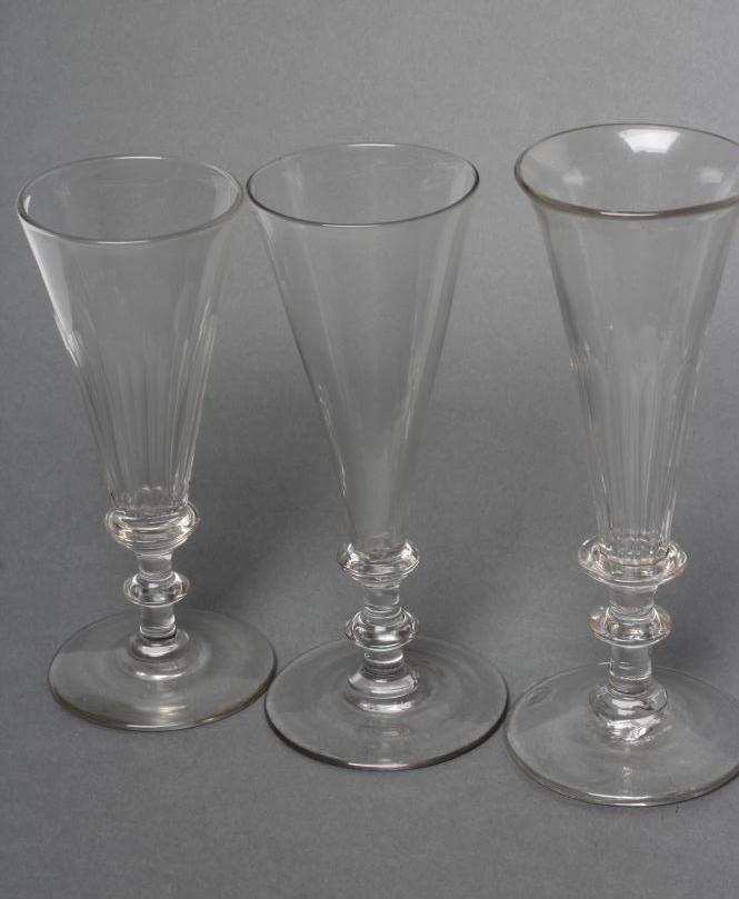 A COLLECTION OF EIGHT CHAMPAGNE FLUTES Image