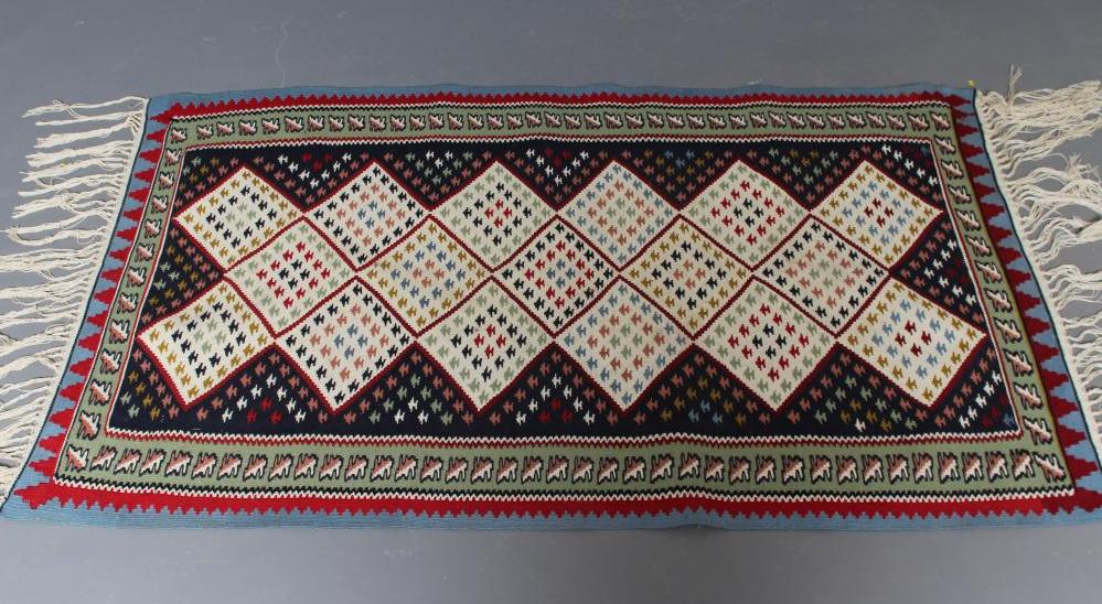 A FLAT WEAVE KILIM RUG Image