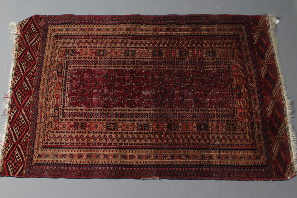 AN AFHGAN RUG in shades of red Image