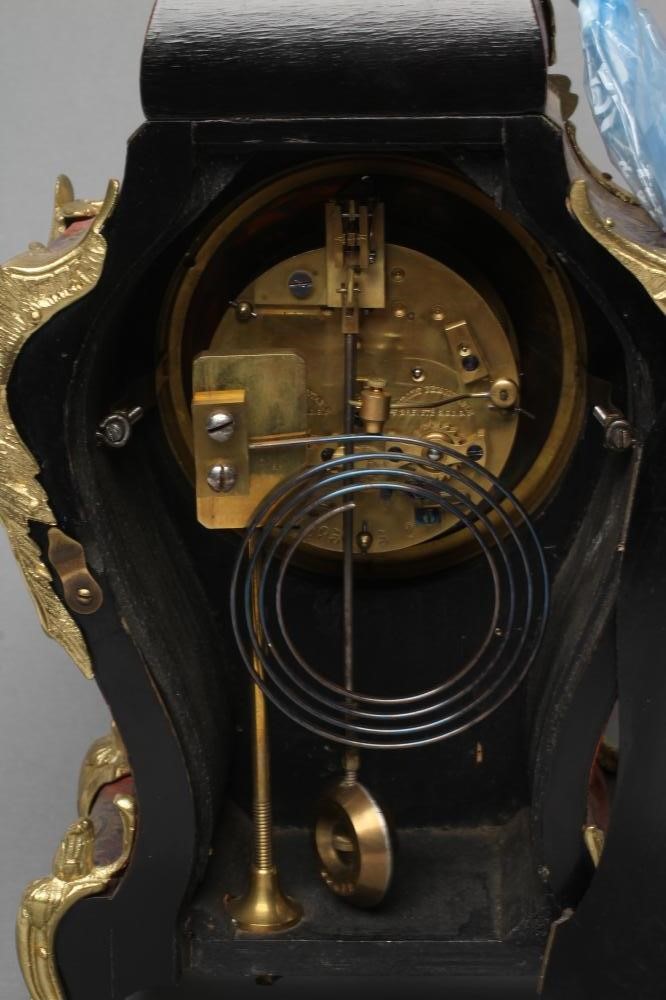 A LOUIS XV STYLE MANTEL CLOCK Image