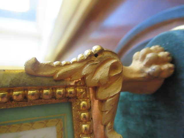 A FRENCH GILT METAL AND INSET PORCELAIN CLOCK GARNITURE Image