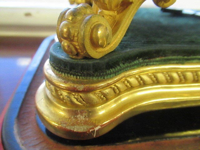 A FRENCH GILT METAL AND INSET PORCELAIN CLOCK GARNITURE Image