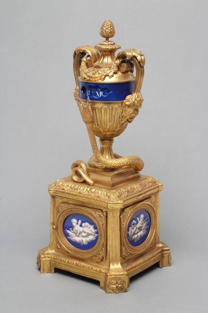 A FRENCH GILT METAL AND PORCELAIN LOUIS XVI STYLE URN CLOCK Image