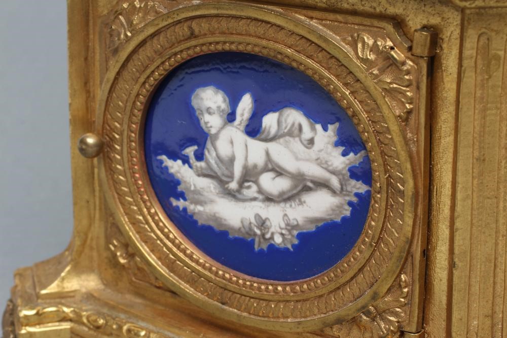 A FRENCH GILT METAL AND PORCELAIN LOUIS XVI STYLE URN CLOCK Image