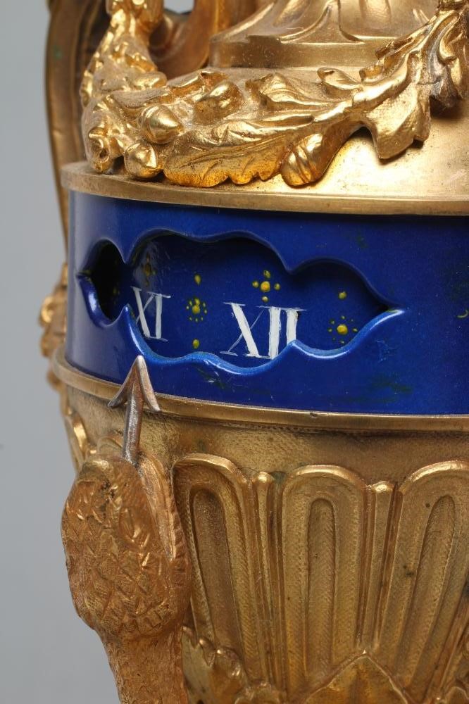 A FRENCH GILT METAL AND PORCELAIN LOUIS XVI STYLE URN CLOCK Image