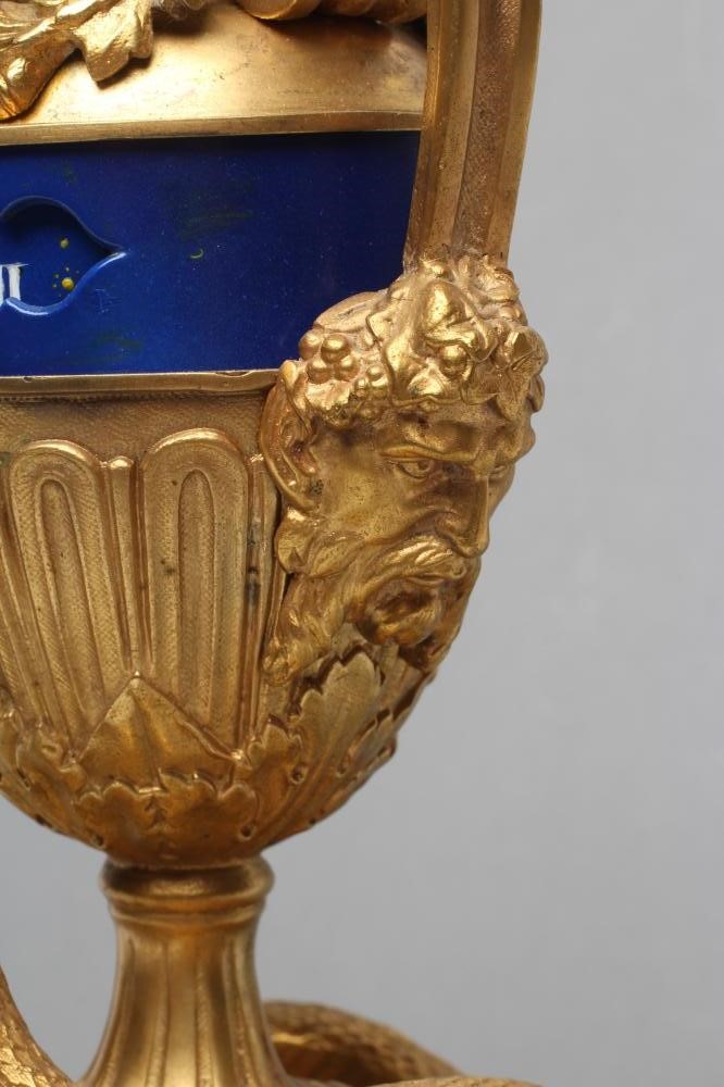 A FRENCH GILT METAL AND PORCELAIN LOUIS XVI STYLE URN CLOCK Image