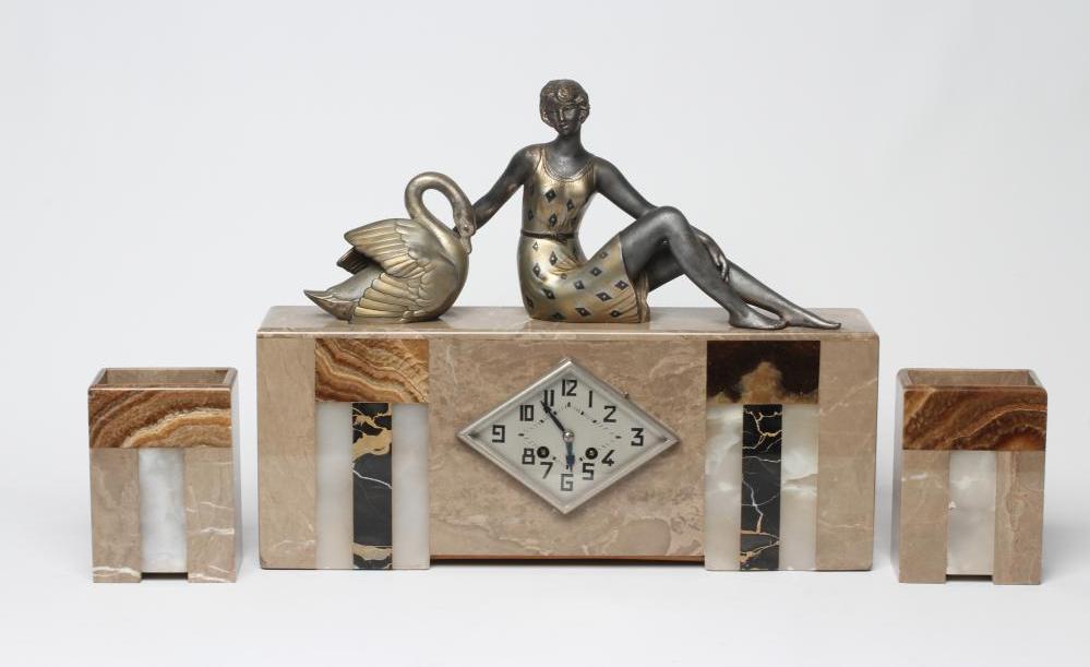 AN ART DECO ONYX AND SPELTER CLOCK GARNITURE Image