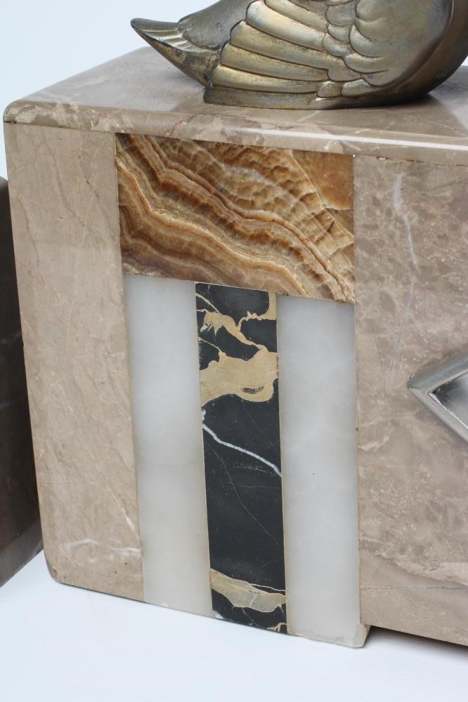 AN ART DECO ONYX AND SPELTER CLOCK GARNITURE Image