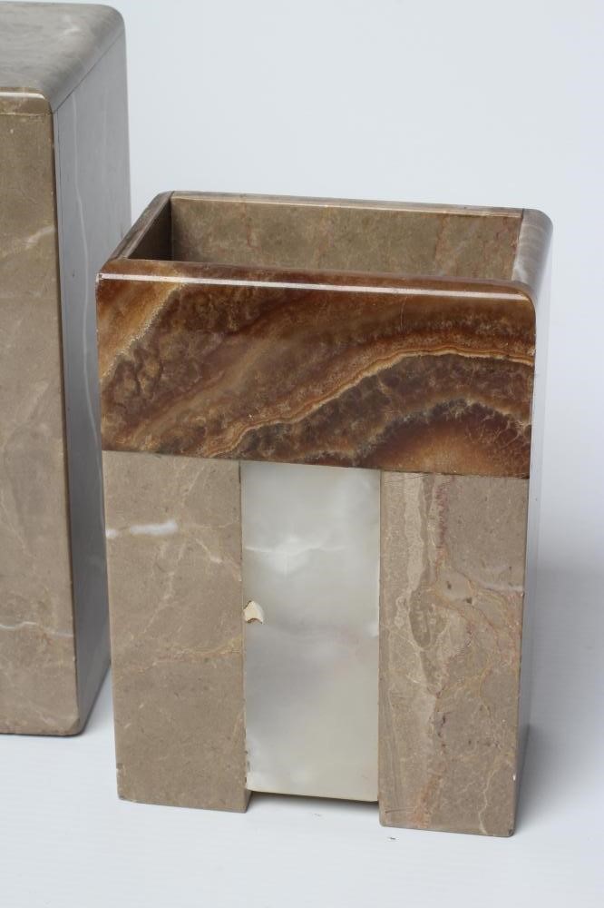 AN ART DECO ONYX AND SPELTER CLOCK GARNITURE Image