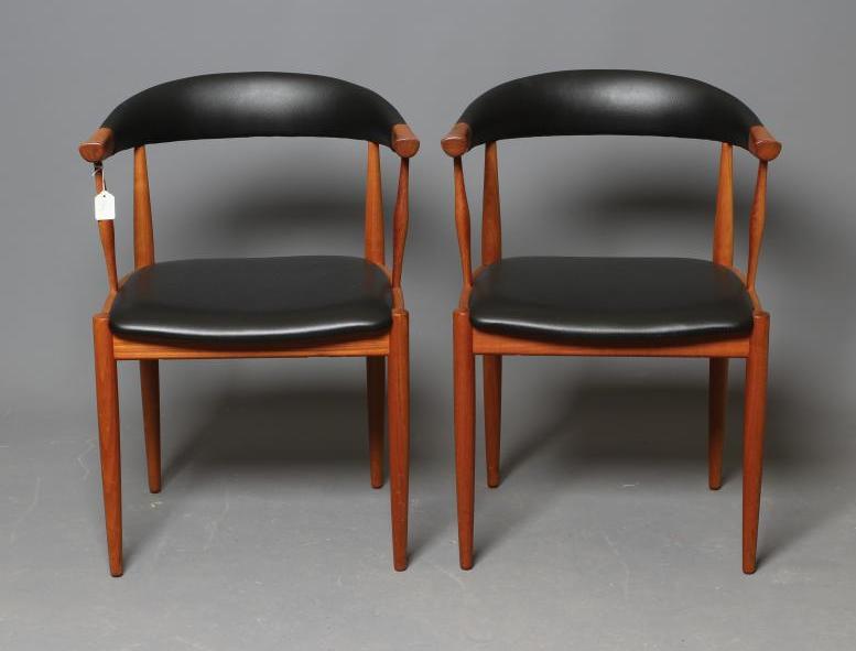 A PAIR OF TEAK ELBOW CHAIRS Image