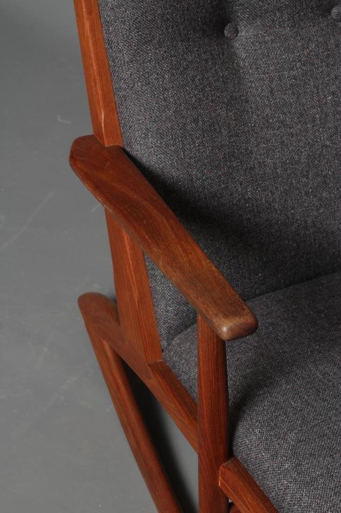 A TEAK ROCKING CHAIR Image