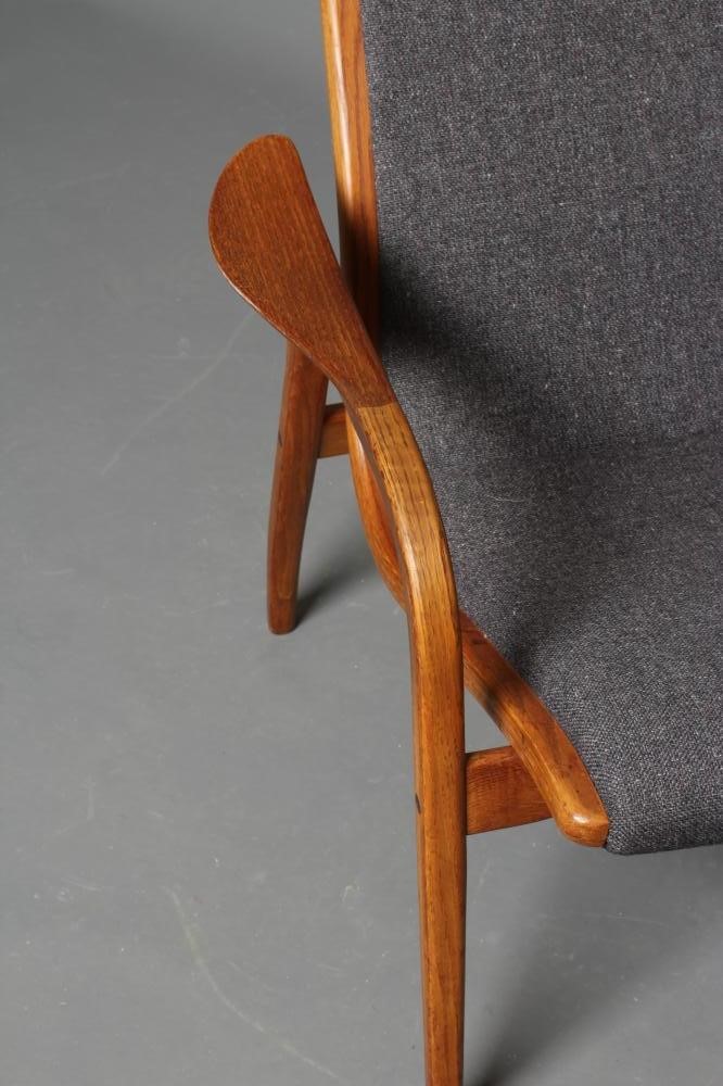 A LAMINO TEAK AND OAK CHAIR by Yngve Ekstrom Image