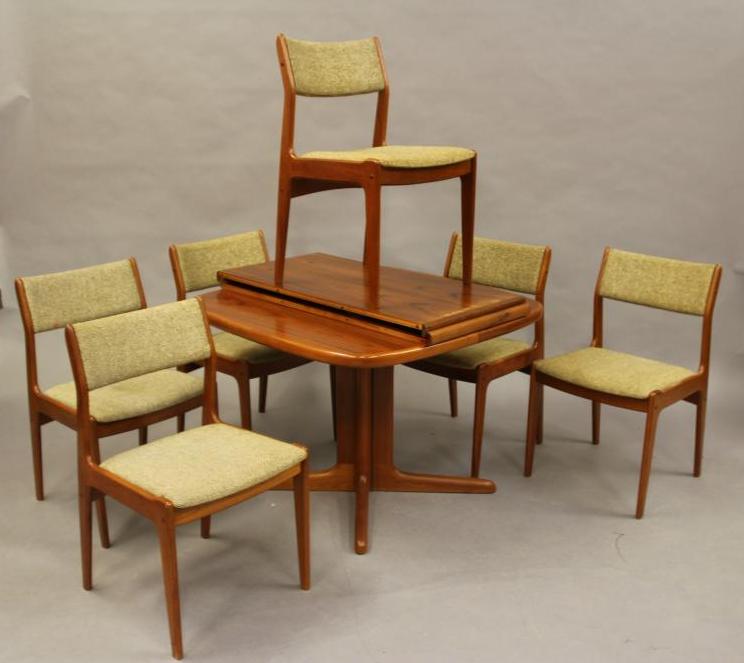 A DANISH TEAK DINING SUITE by Skovby Image