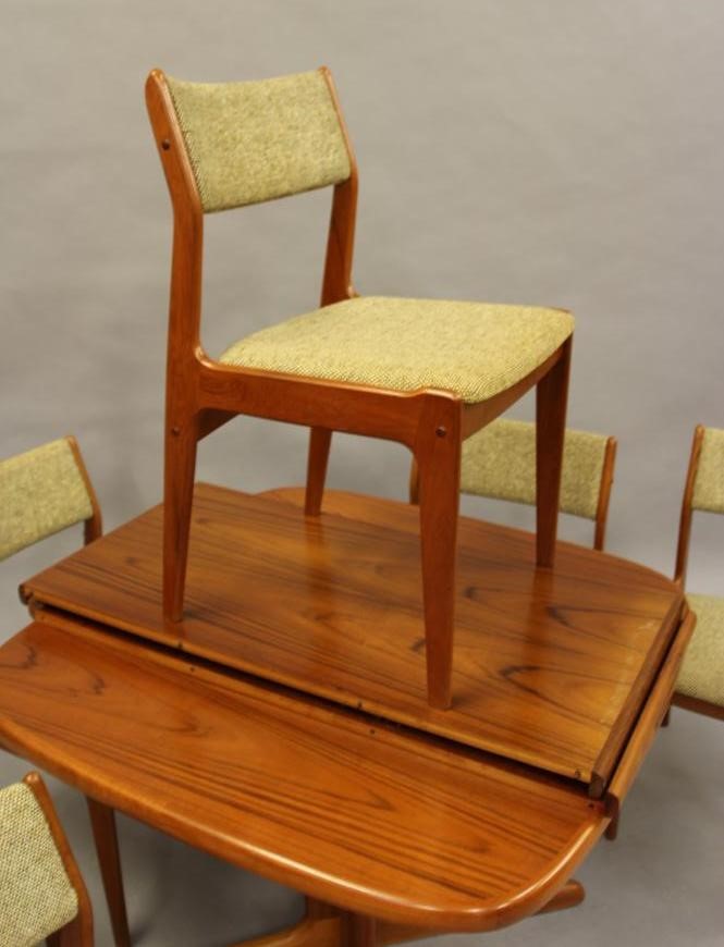 A DANISH TEAK DINING SUITE by Skovby Image