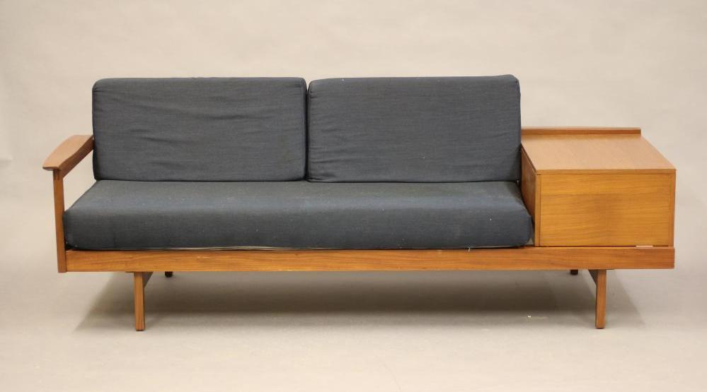 A GUY ROGERS TEAK LOUNGE SUITE comprising a pair of arm chairs button upholstered in deep blue tweed Image
