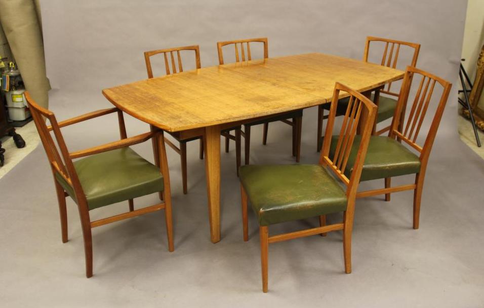 A GORDON RUSSELL OF BROADWAY TEAK DINING TABLE AND CHAIRS Image