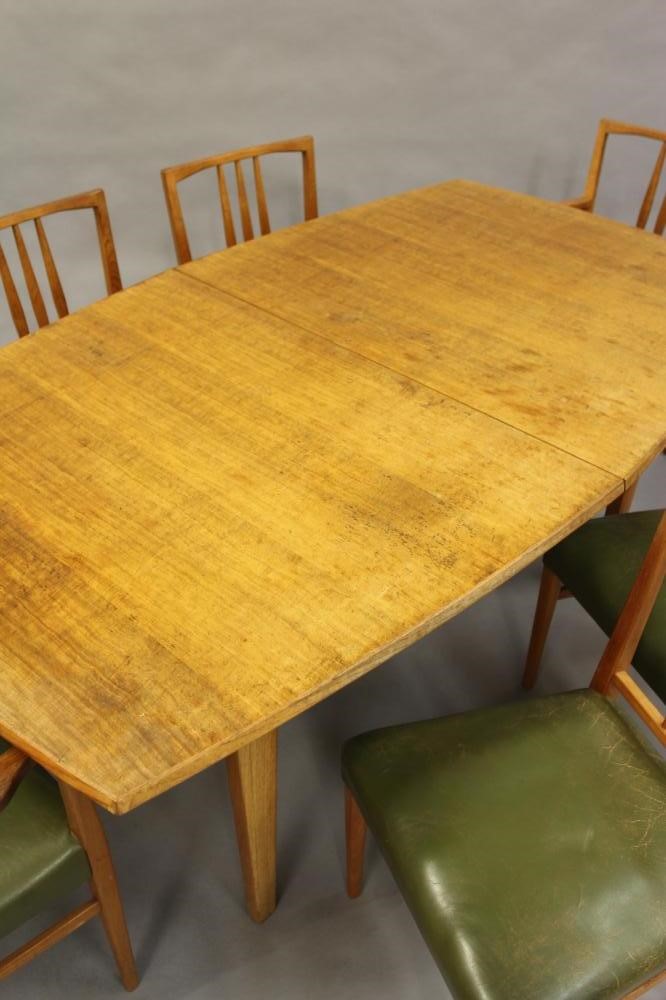 A GORDON RUSSELL OF BROADWAY TEAK DINING TABLE AND CHAIRS Image