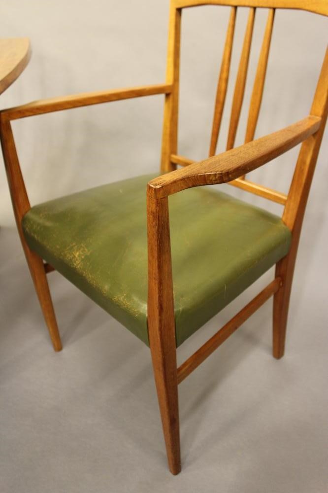 A GORDON RUSSELL OF BROADWAY TEAK DINING TABLE AND CHAIRS Image
