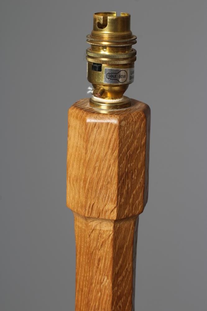 A ROBERT THOMPSON ADZED OAK STANDARD LAMP Image