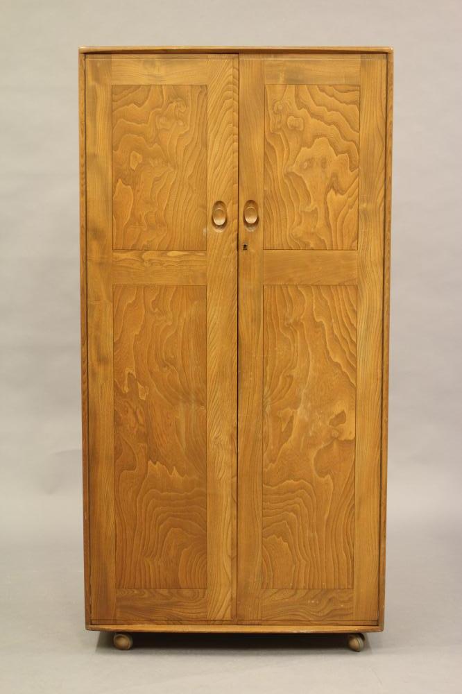 AN ERCOL ELM WINDSOR WARDROBE Image