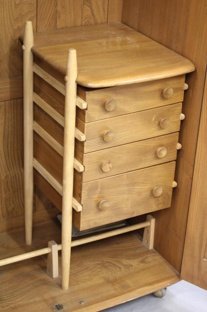 AN ERCOL ELM WINDSOR WARDROBE Image