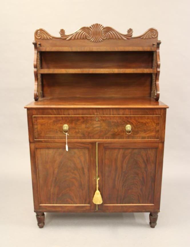 A MAHOGANY SECRETAIRE CABINET Image