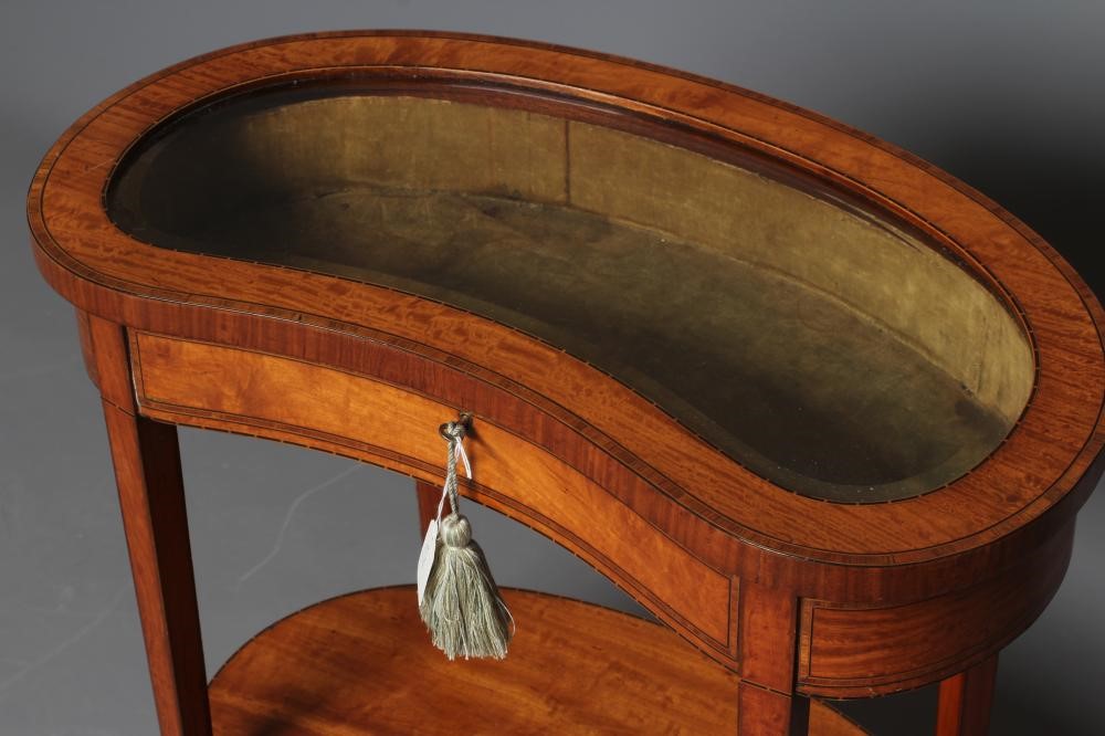 AN EDWARDIAN SATINWOOD BIJOUTERIE TABLE of kidney form Image