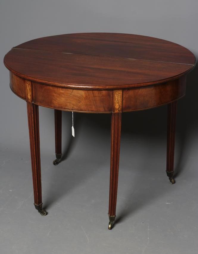 A GEORGIAN MAHOGANY FOLDING TEA TABLE Image