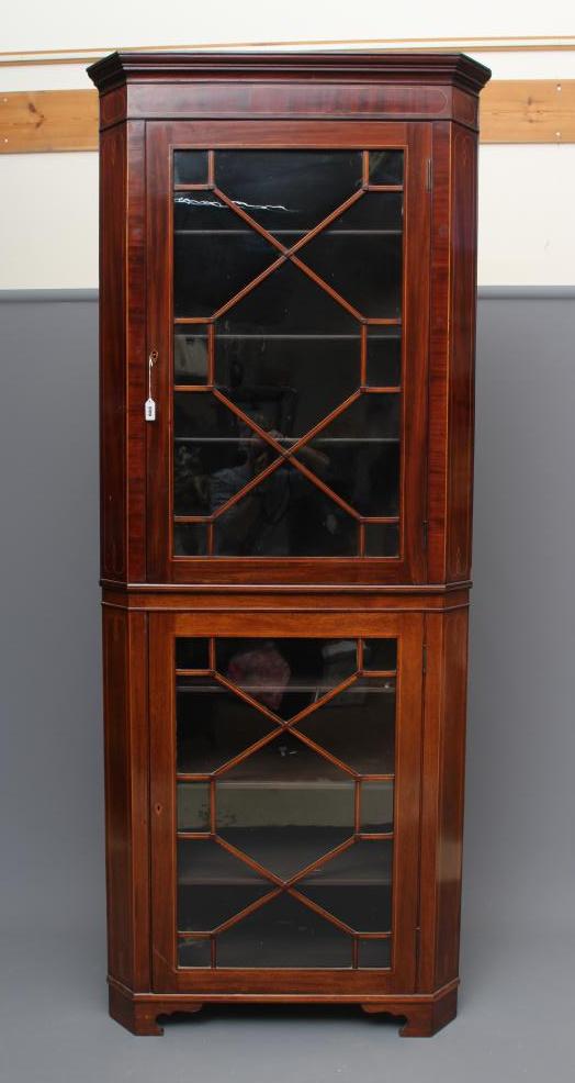 A MAHOGANY STANDING CORNER CUPBOARD Image