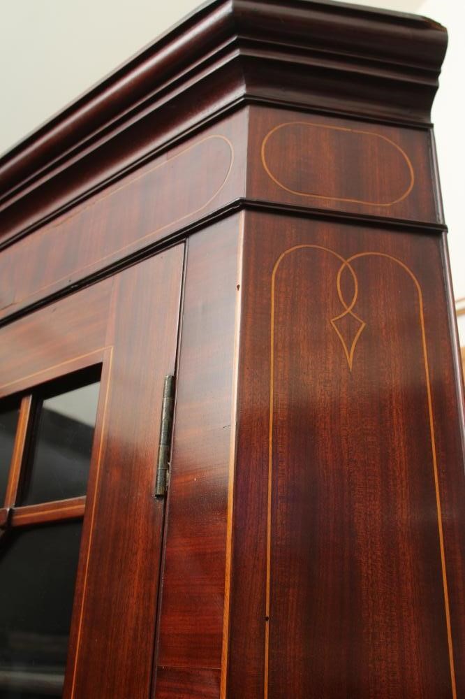 A MAHOGANY STANDING CORNER CUPBOARD Image