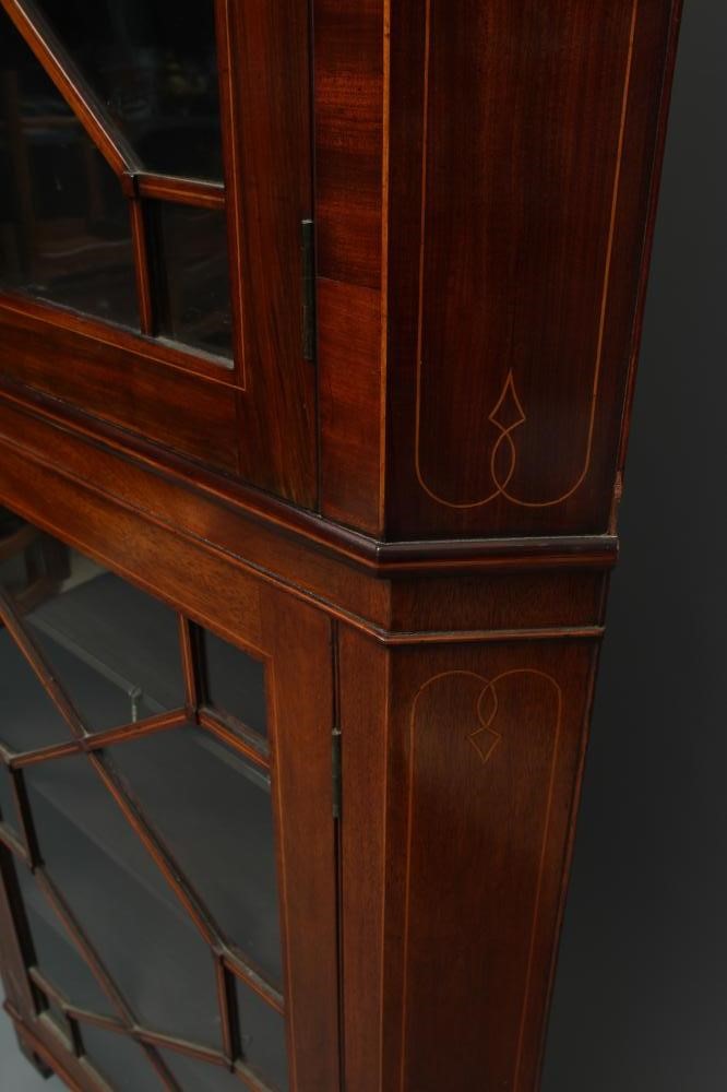 A MAHOGANY STANDING CORNER CUPBOARD Image