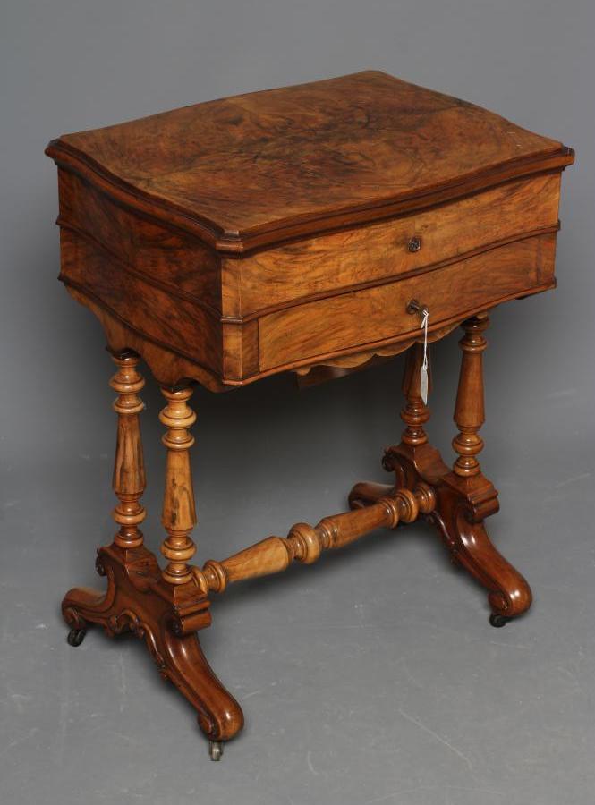 A VICTORIAN BURR WALNUT WORK TABLE of serpentine oblong form Image