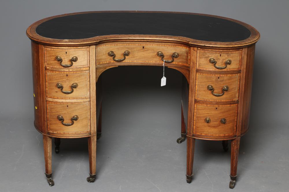 A LATE VICTORIAN DESK of kidney form Image