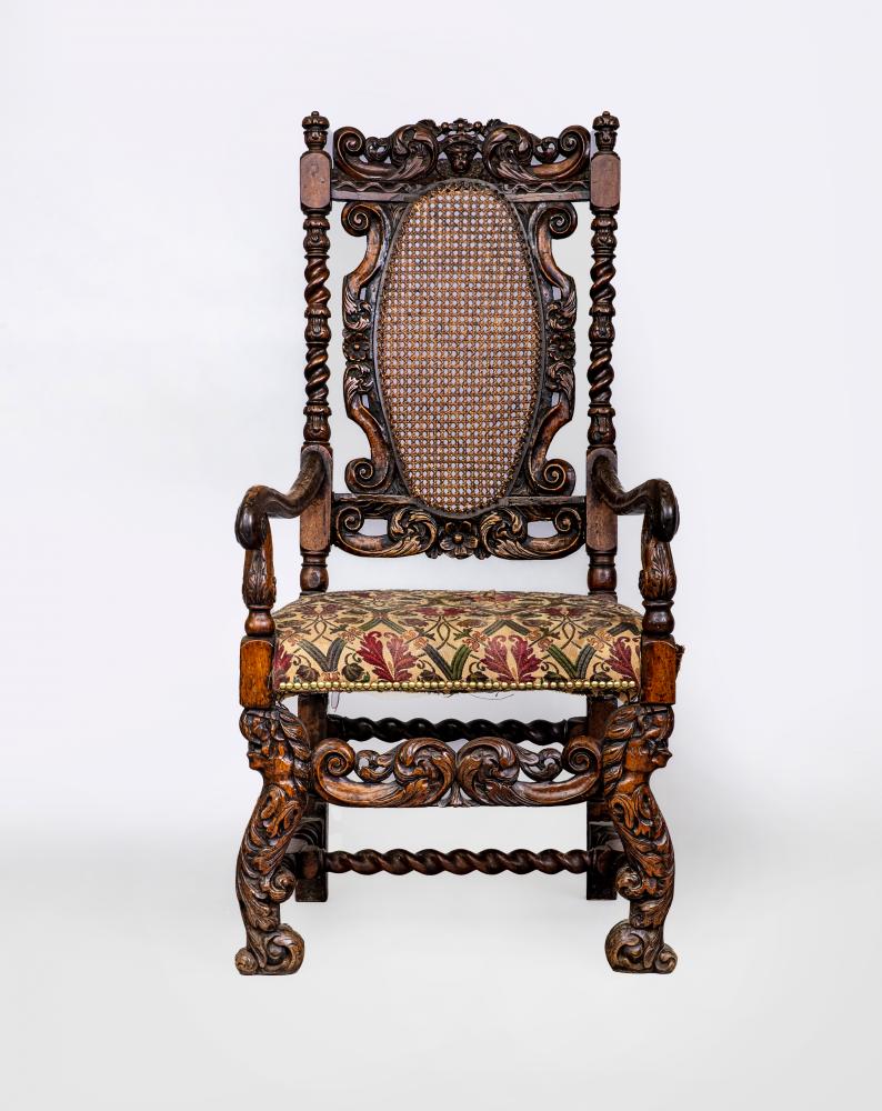A CHARLES II CARVED WALNUT HIGH BACK ARMCHAIR Image