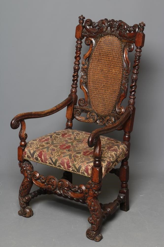 A CHARLES II CARVED WALNUT HIGH BACK ARMCHAIR Image