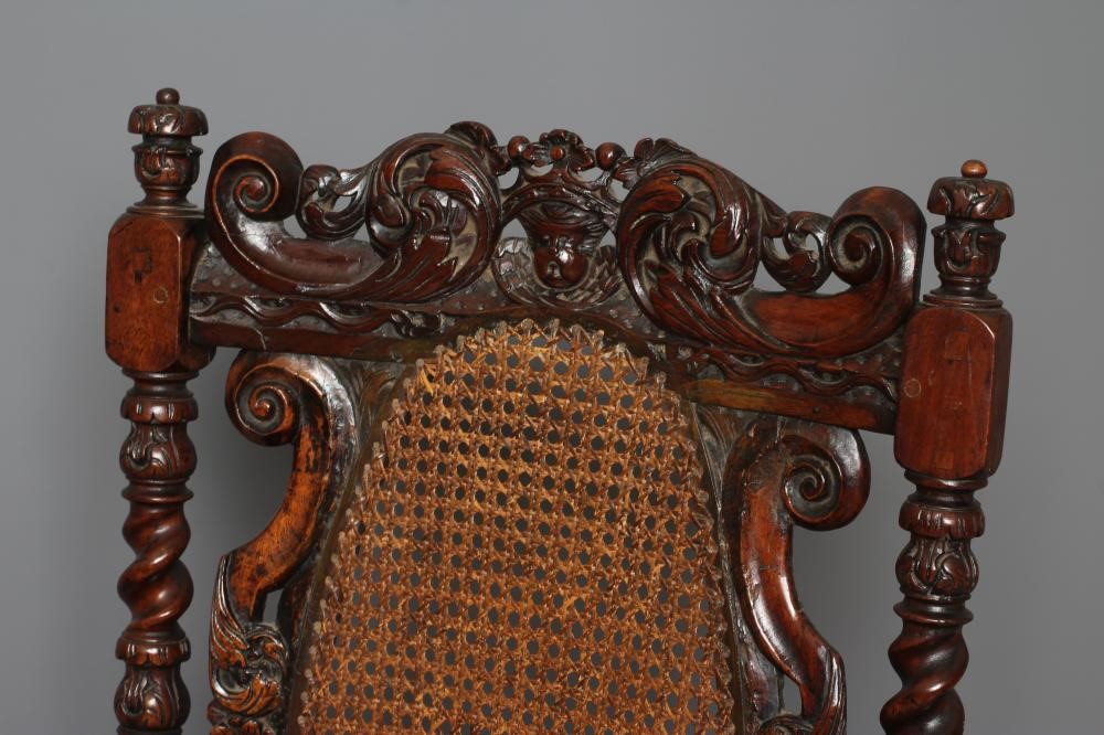 A CHARLES II CARVED WALNUT HIGH BACK ARMCHAIR Image
