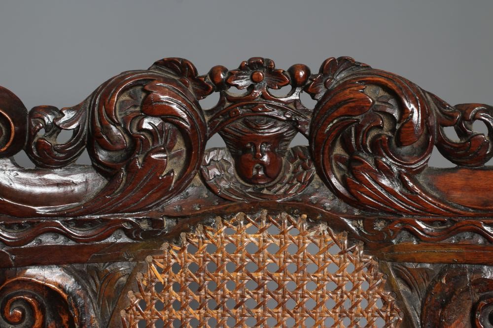 A CHARLES II CARVED WALNUT HIGH BACK ARMCHAIR Image