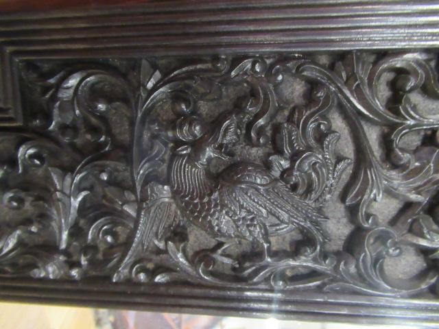 AN INDIAN CARVED EBONY(?) FRAME Image