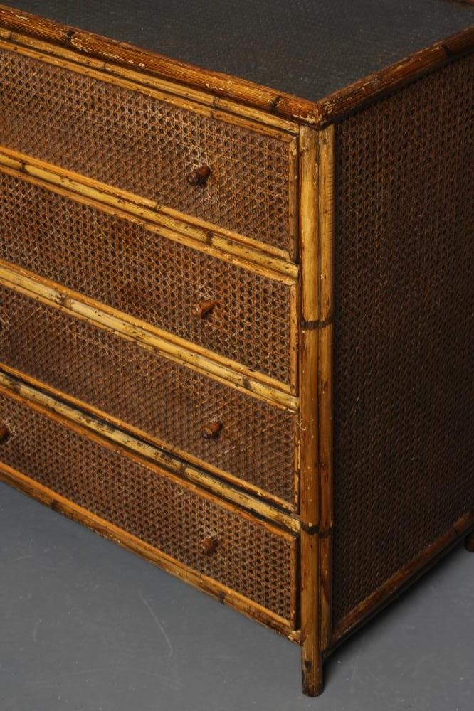 AN EDWARDIAN BAMBOO AND WICKER CHEST of four long drawers with turned wood handles and inset glass Image