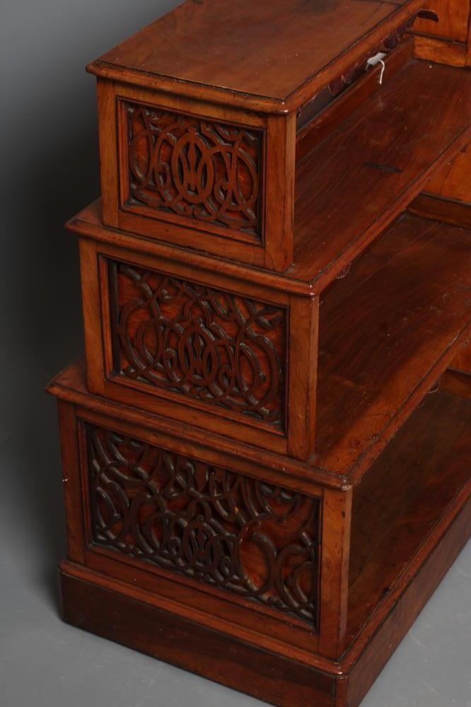 A SMALL VICTORIAN WALNUT FREE STANDING OPEN BOOKCASE of stepped rounded oblong form Image