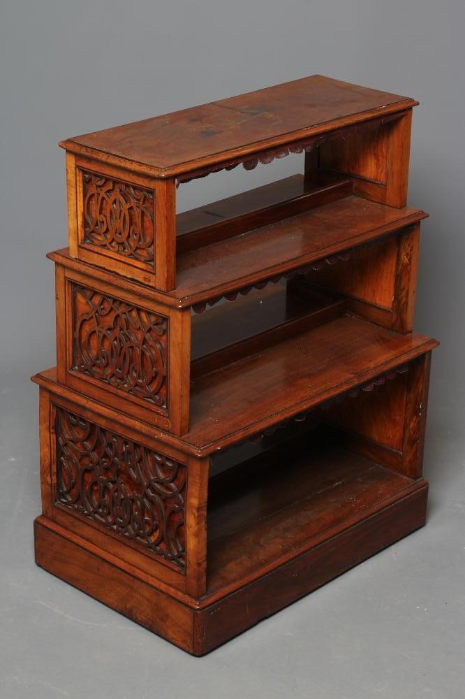 A SMALL VICTORIAN WALNUT FREE STANDING OPEN BOOKCASE of stepped rounded oblong form Image