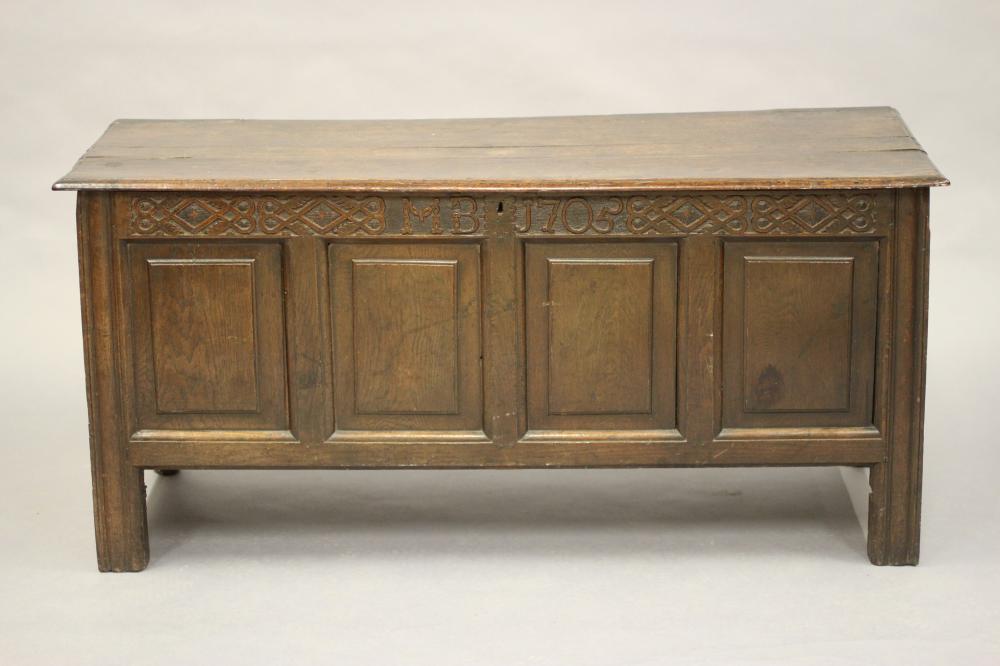 AN OAK PANELLED COFFER Image